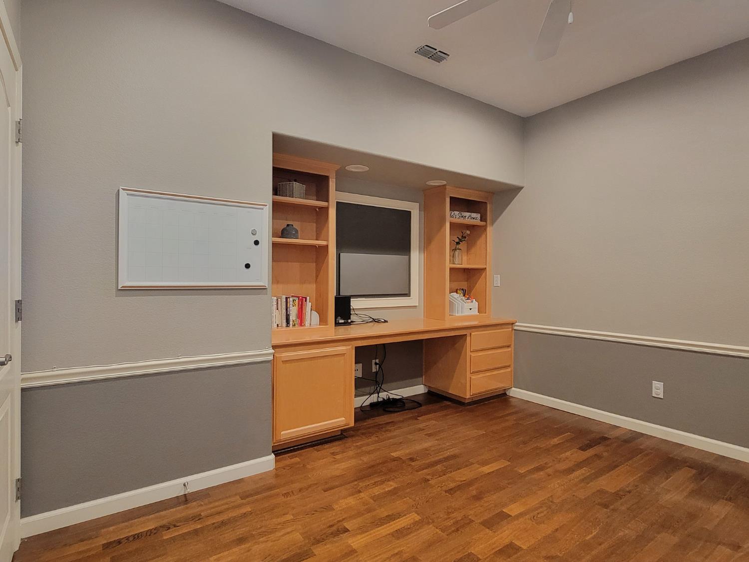 1607 Three Rivers Drive Marysville, CA 95901 - Photo 12 of 47 a room with wooden floor and white walls