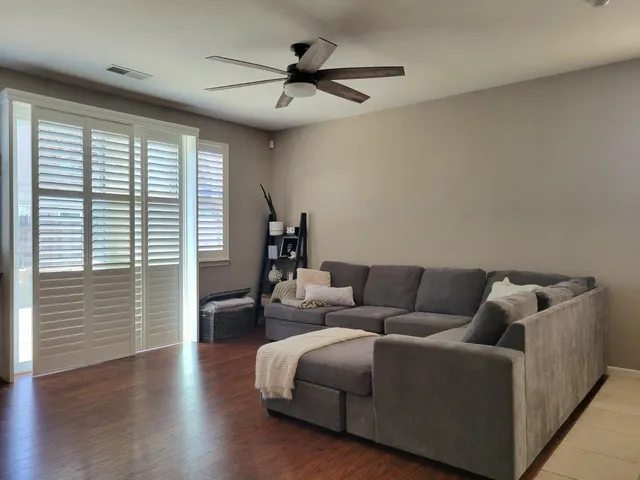 a large kitchen with a table and chairs