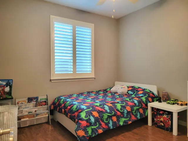 a view of a hallway with a bathroom