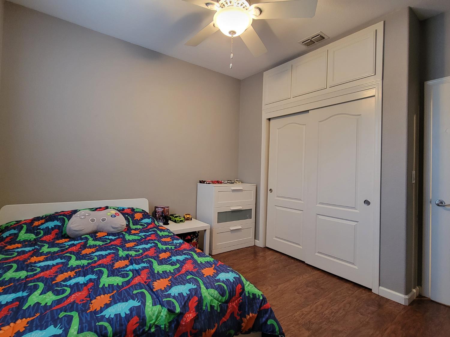 1607 Three Rivers Drive Marysville, CA 95901 - Photo 31 of 47 a bedroom with a bed and a chandelier