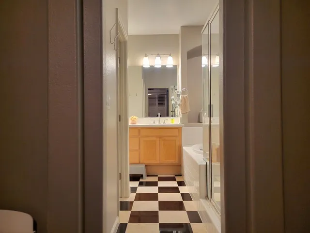 a bathroom with a bathtub and a shower