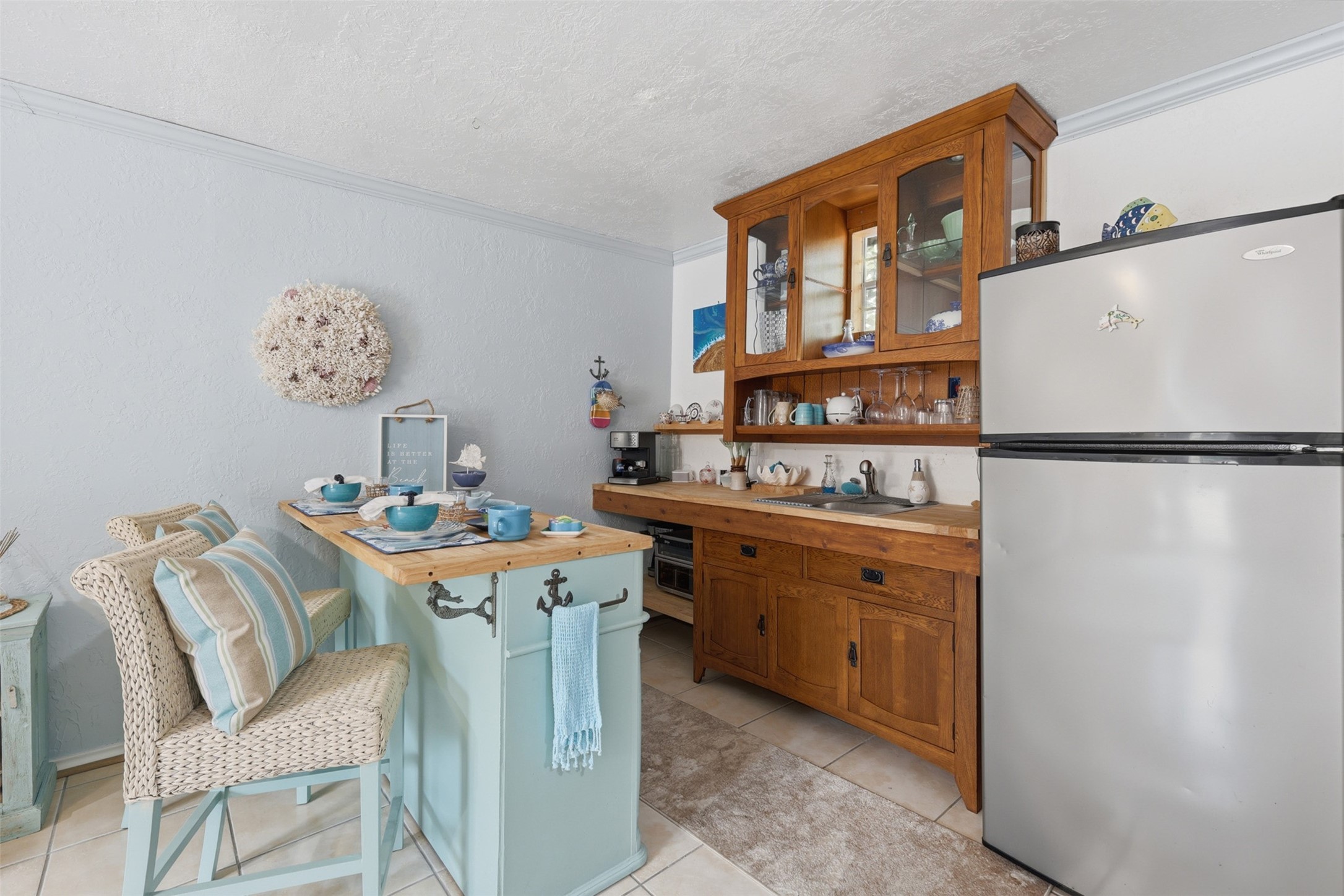 7010 River Mill Drive Spring, TX 77379 - Photo 27 of 29 a room with a table chairs and a refrigerator