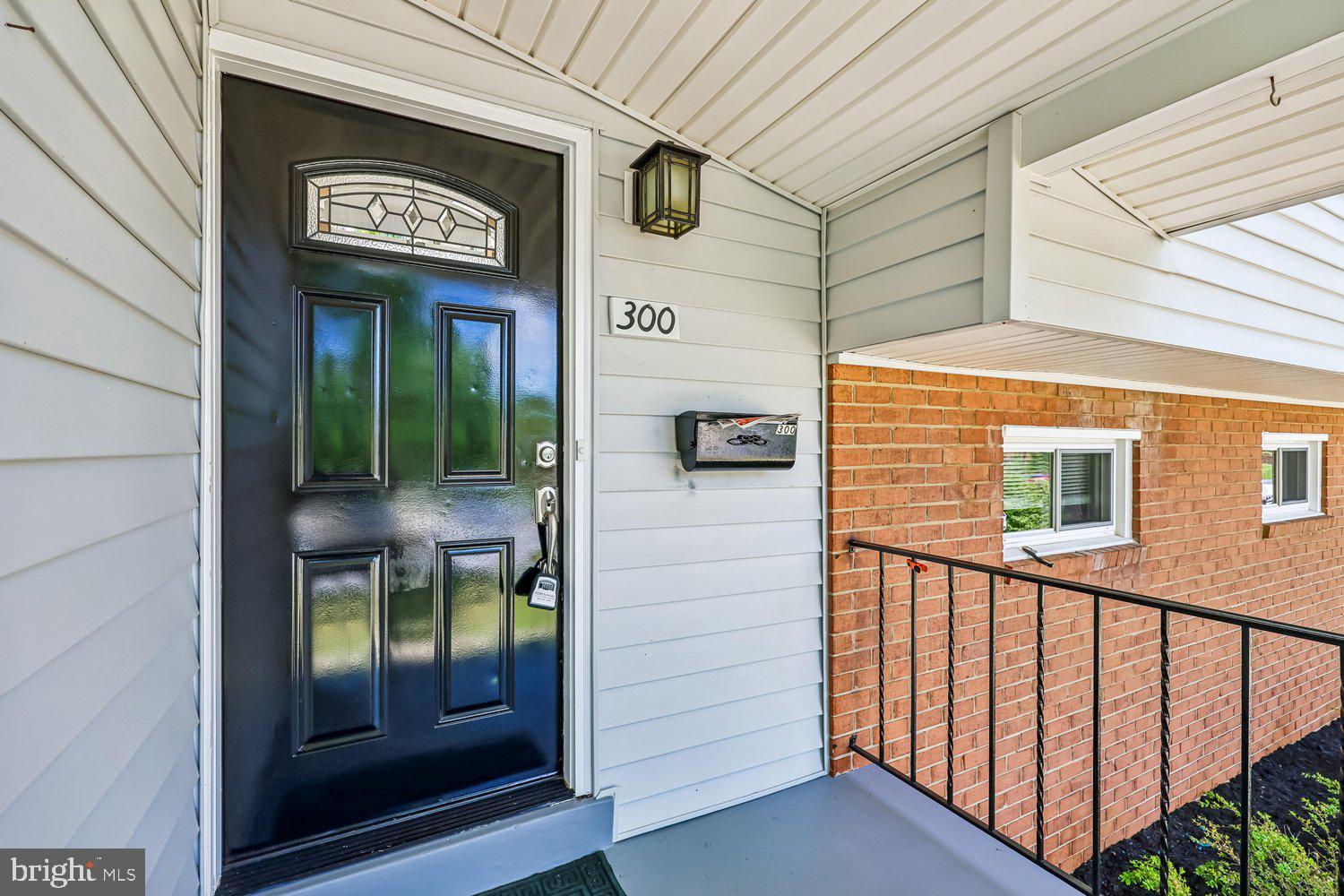 300 Gilsan Court Silver Spring, MD 20902 - Photo 14 of 117 a front view of a building with glass door and door