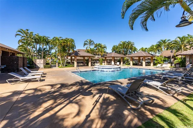 a view of a swimming pool with a patio