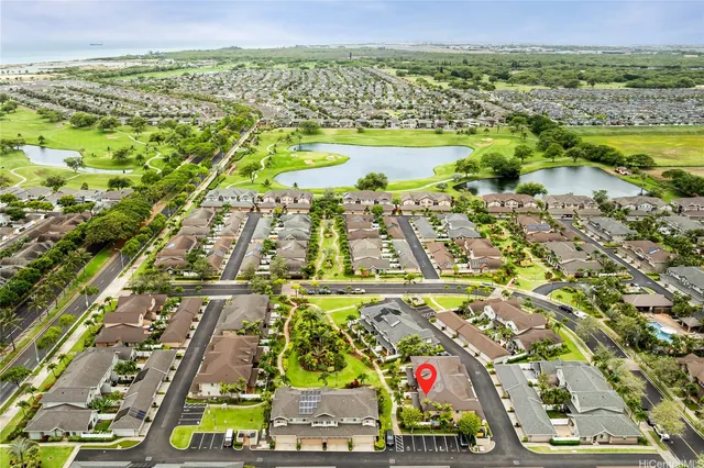 an aerial view of residential building and lake