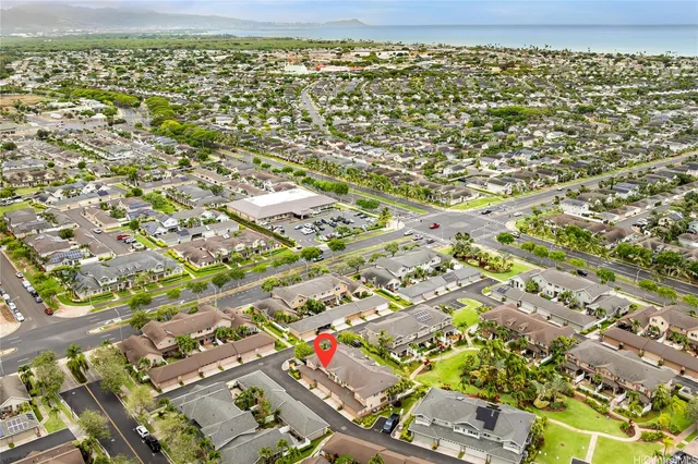 an aerial view of residential houses with outdoor space