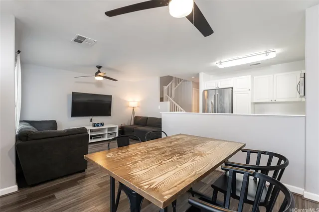 a view of a livingroom with furniture and a flat screen tv