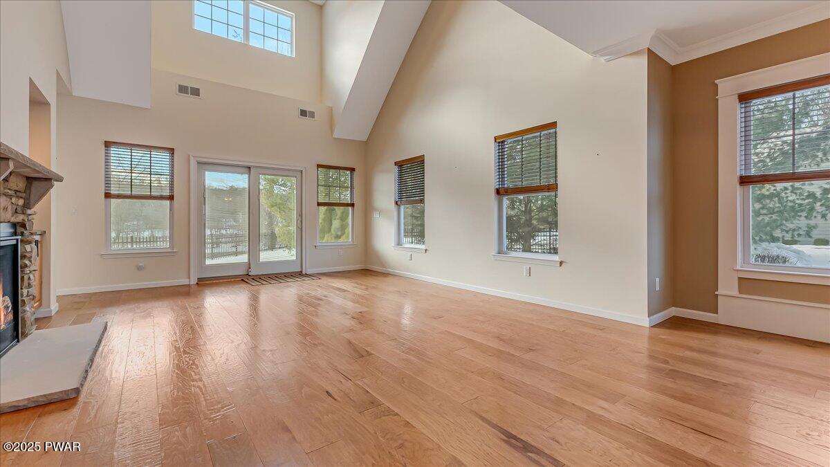 1010 MacIntosh Way Matamoras, PA 18336 - Photo 10 of 60 a view of an empty room with wooden floor and a window