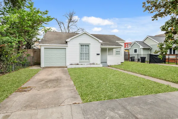 front view of a house with a yard