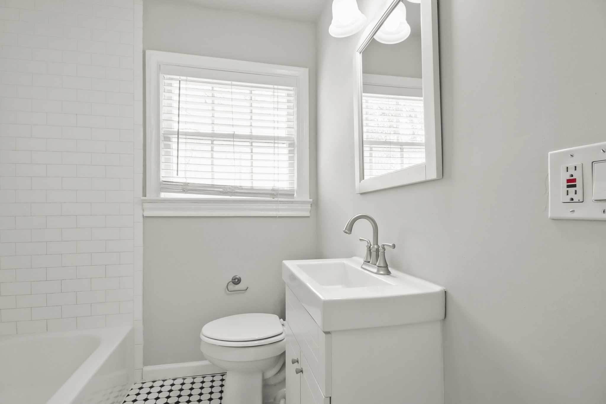 927 Walling Street Houston, TX 77009 - Photo 8 of 13 a bathroom with a sink a toilet and a window
