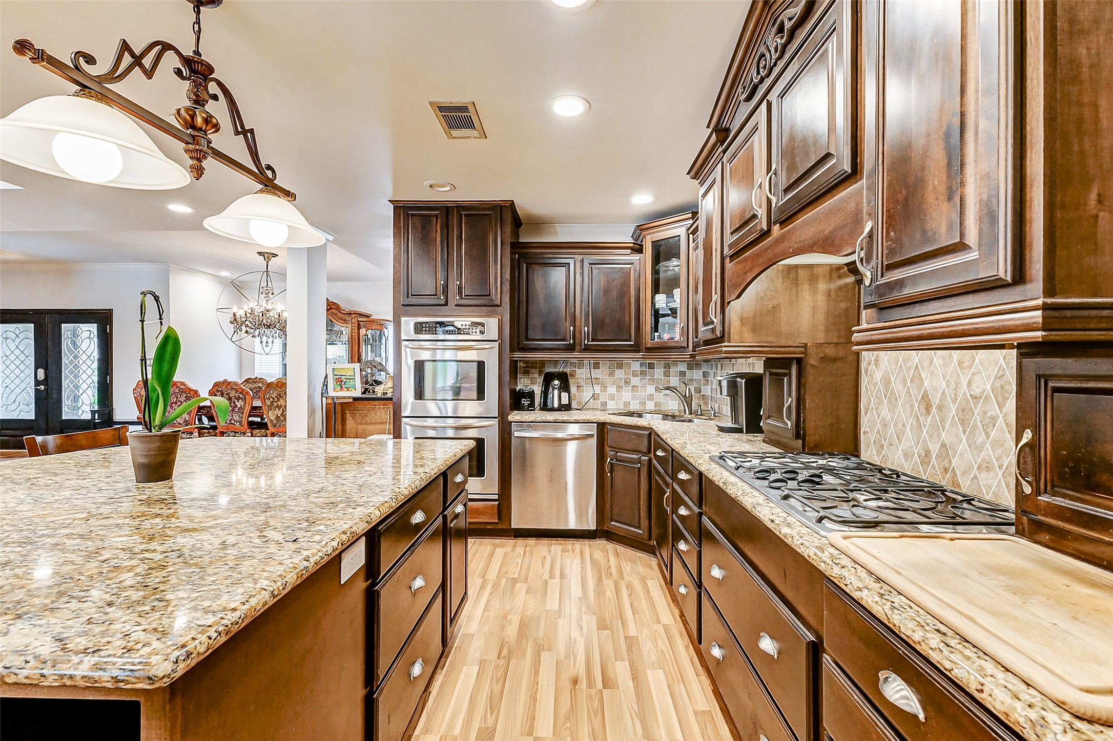3022 Triway Lane Houston, TX 77043 - Photo 14 of 43 Unleash your inner chef with the 5 burner stovetop and double ovens in this large kitchen!