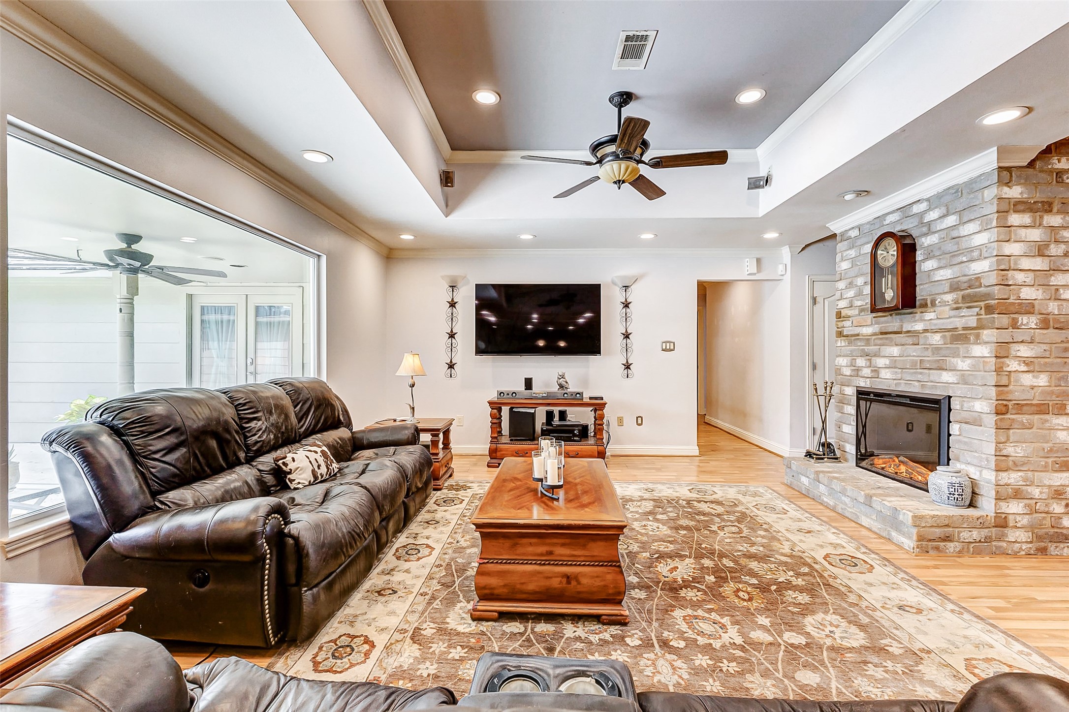 3022 Triway Lane Houston, TX 77043 - Photo 19 of 43 a living room with furniture and a flat screen tv