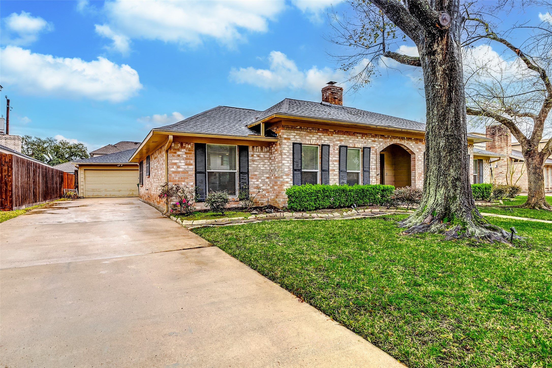3022 Triway Lane Houston, TX 77043 - Photo 3 of 43 a front view of a house with a yard and potted plants