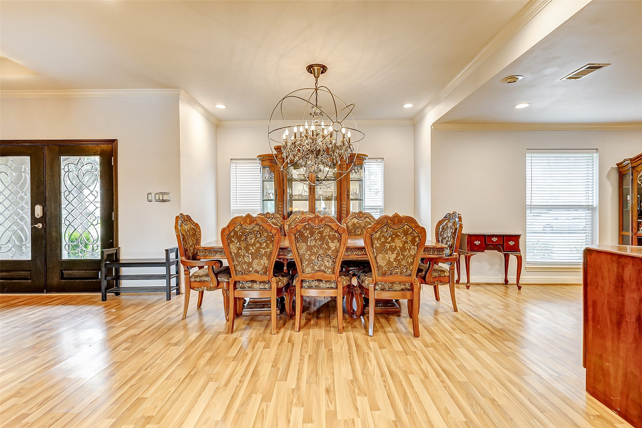 3022 Triway Lane Houston, TX 77043 - Photo 8 of 43 a view of a dining room with furniture and wooden floor