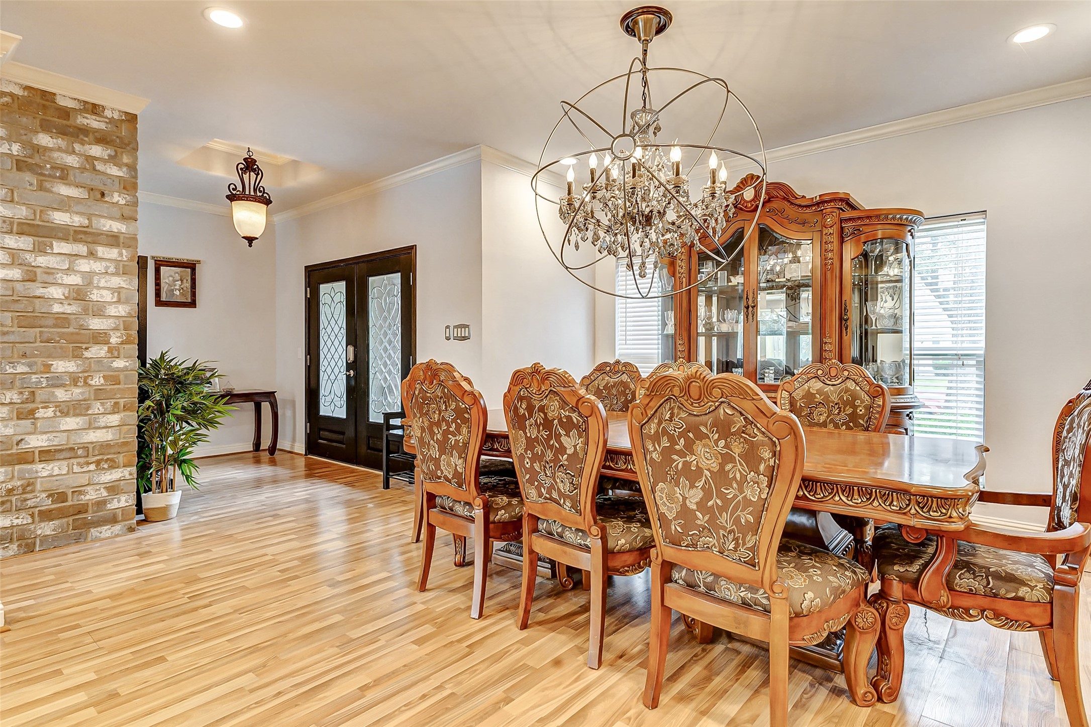 3022 Triway Lane Houston, TX 77043 - Photo 9 of 43 a view of a dining room with furniture and wooden floor