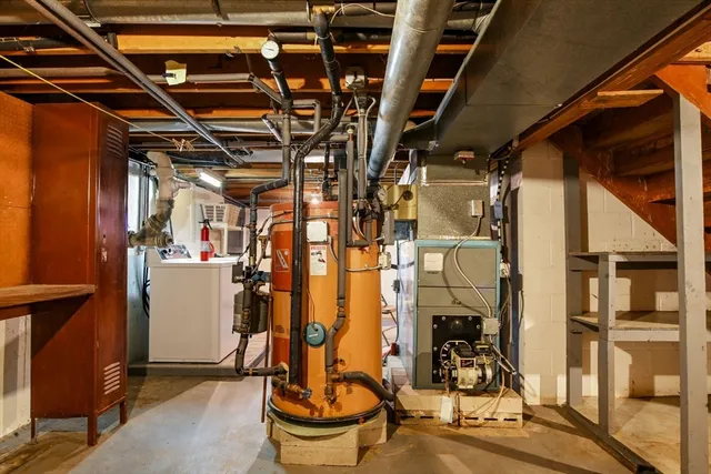 a view of storage and utility room with washer and dryer