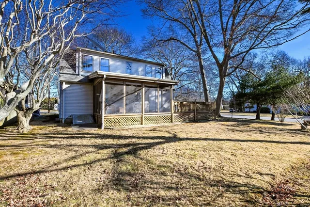 a view of a street with a small yard