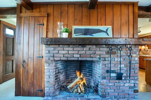 a kitchen with sink refrigerator and cabinets