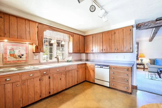 a dining room with furniture and a window