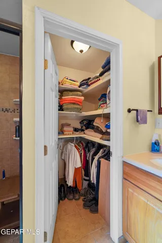 a bedroom with a bed and flat screen tv