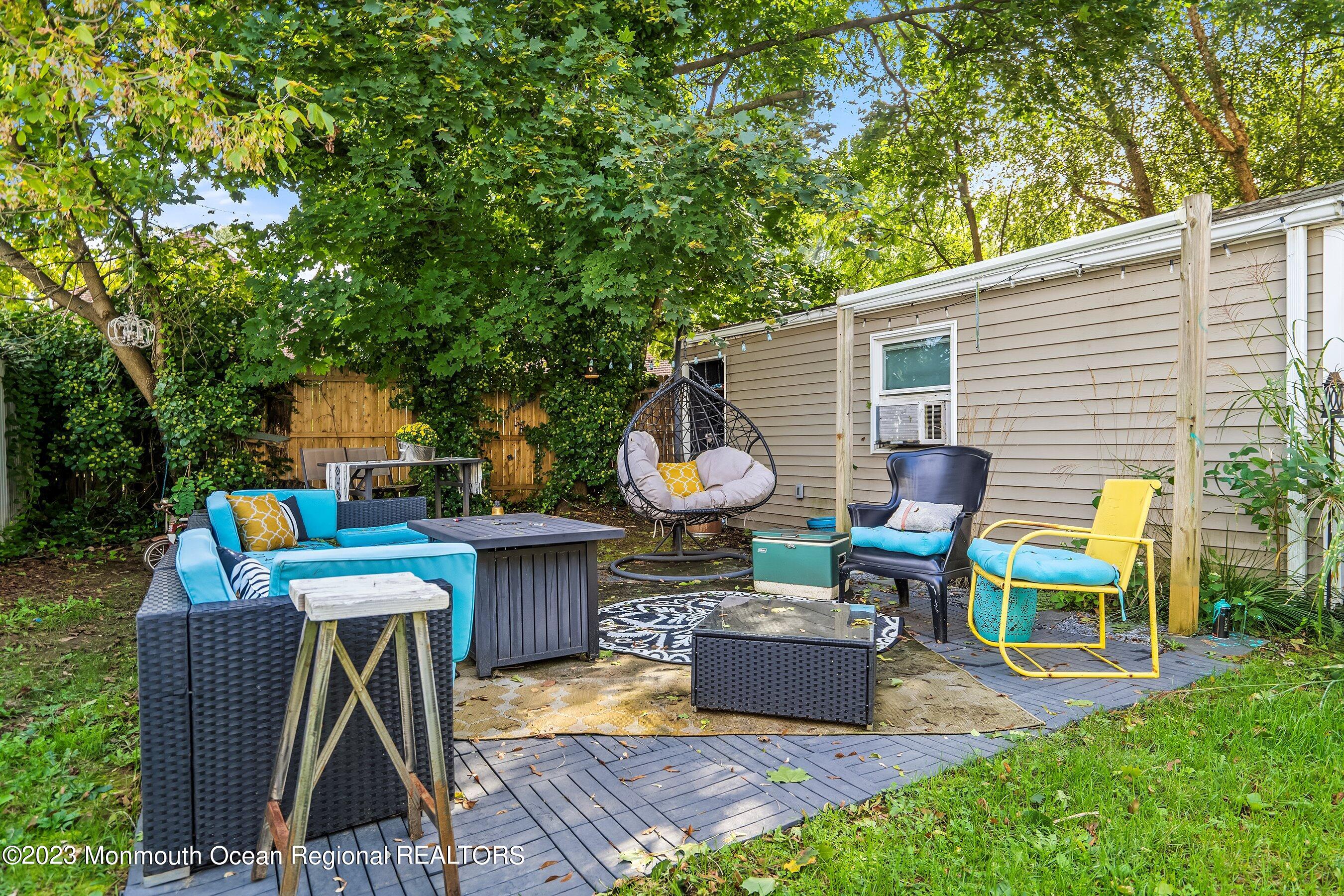 24 St Nicholas Place Red Bank, NJ 07701 - Photo 11 of 11 a view of a chairs and table in backyard of the house