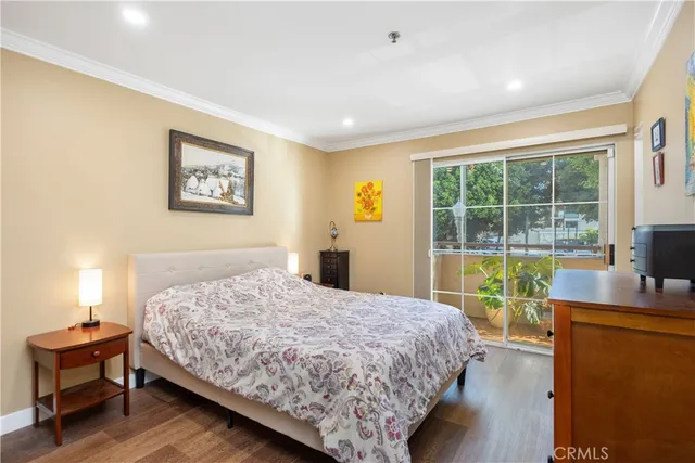 a bedroom with a bed and a desk