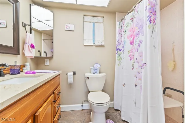a bathroom with a sink toilet and vanity