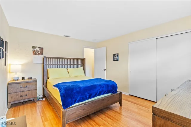 a bedroom with a bed and a closet