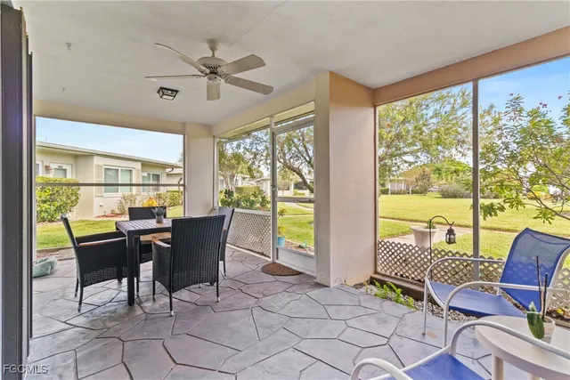 a view of a dining room with furniture window and outside view