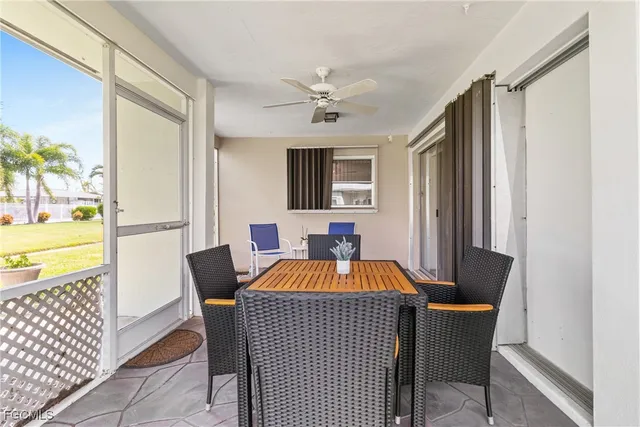 a living room with furniture a table and a flat screen tv