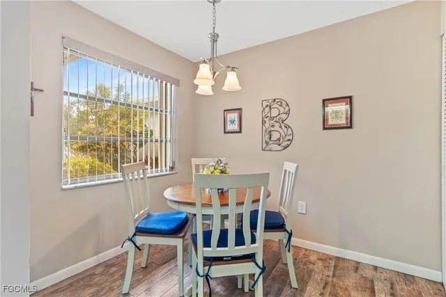 a dining room with furniture and window