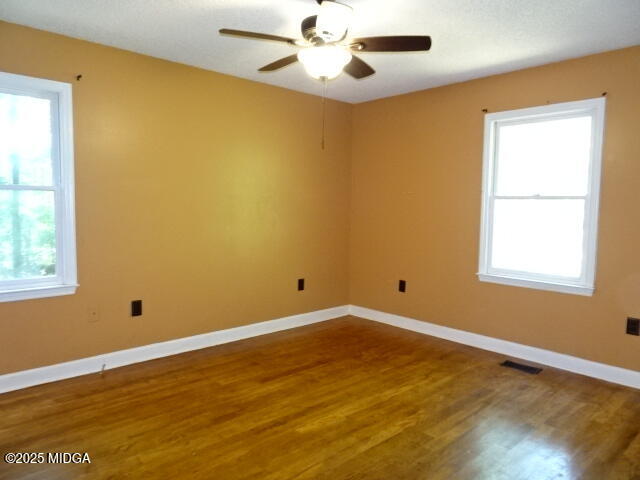 981 Santa Fe Trail Macon, GA 31220 - Photo 15 of 17 a view of an empty room with wooden floor and a window