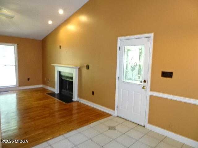 981 Santa Fe Trail Macon, GA 31220 - Photo 5 of 17 a view of empty room with wooden floor and fireplace
