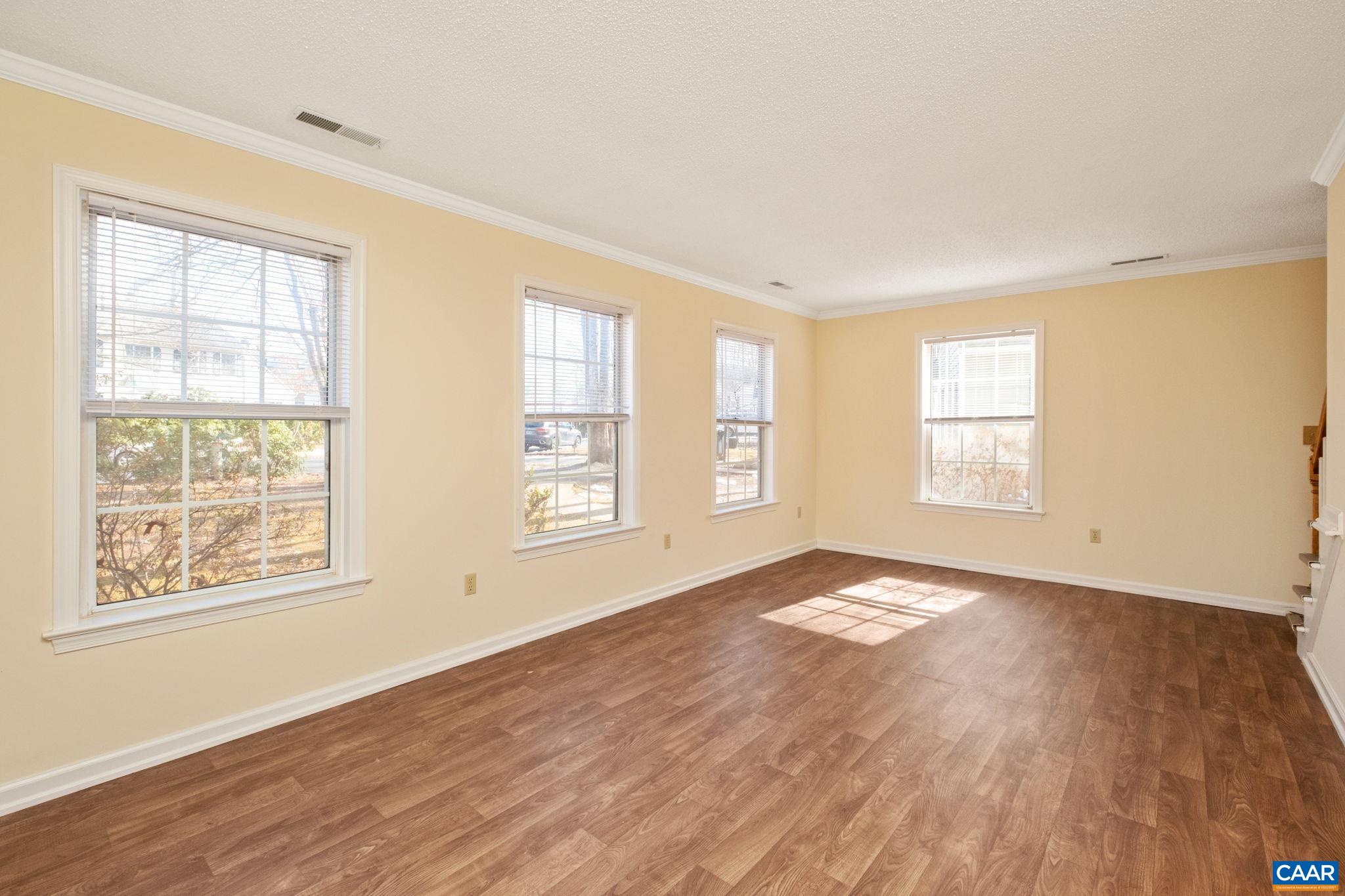 320 Westfield Road Charlottesville, VA 22901 - Photo 14 of 29 an empty room with wooden floor and windows