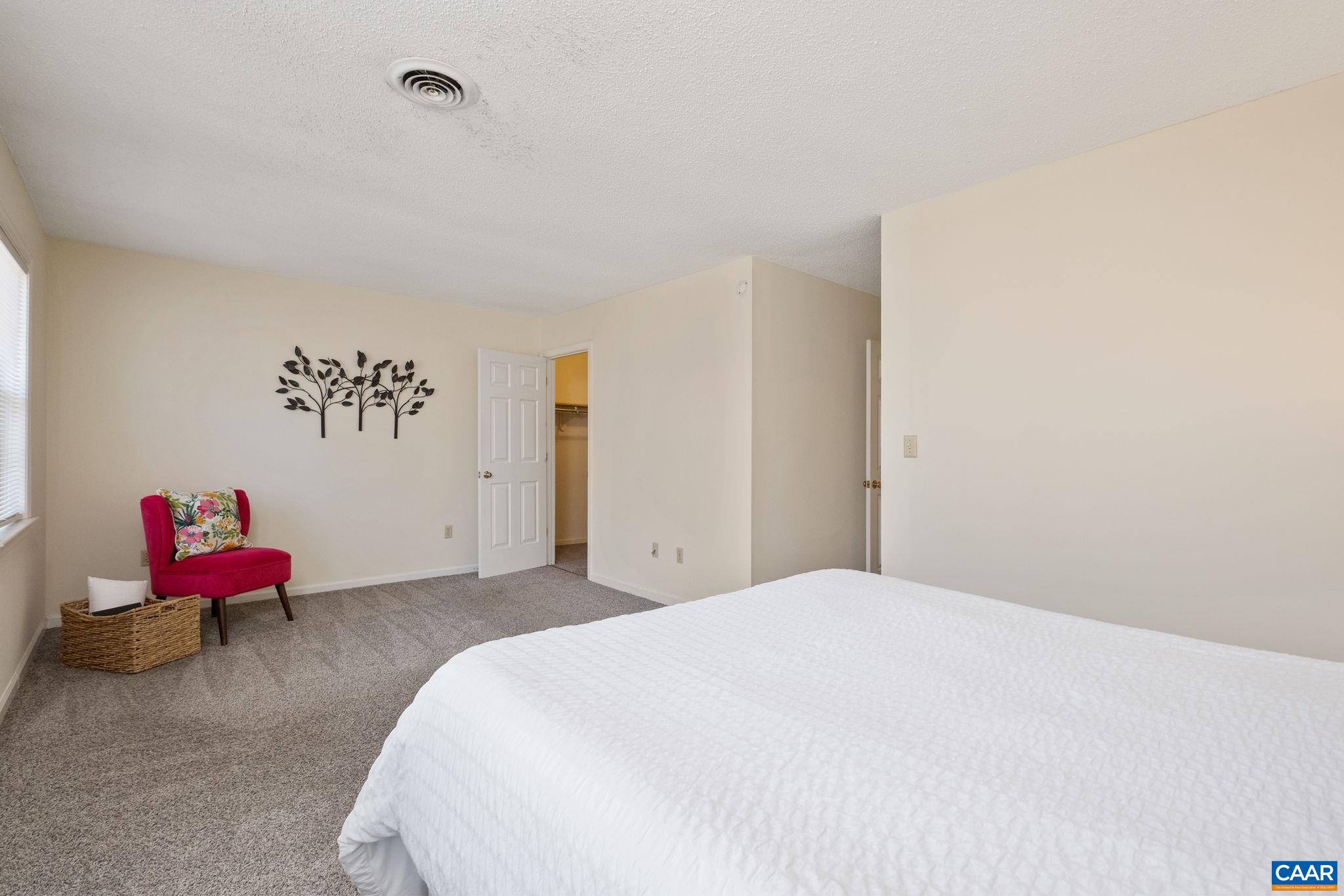 320 Westfield Road Charlottesville, VA 22901 - Photo 19 of 29 a bedroom with a bed and chair