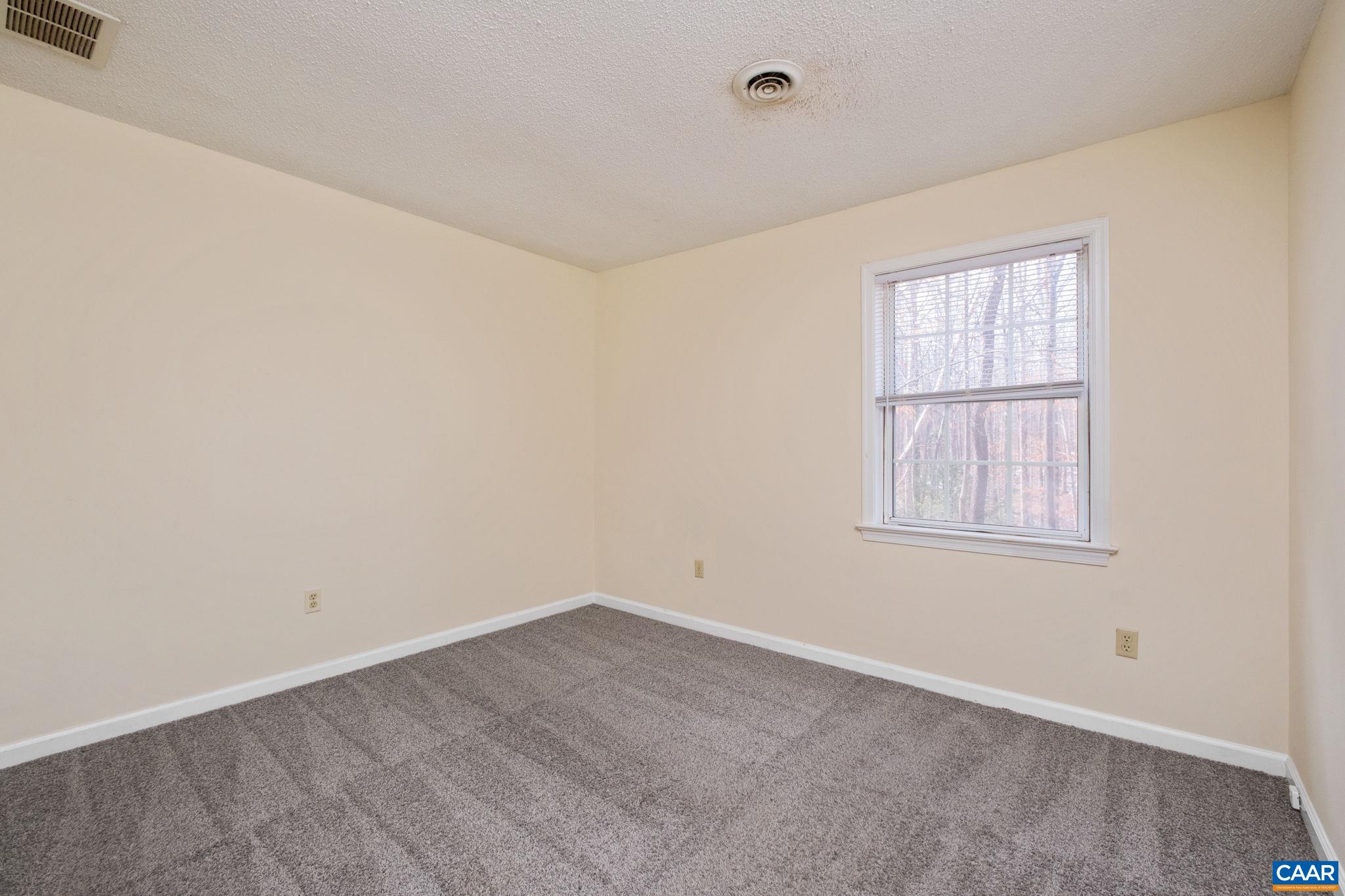 320 Westfield Road Charlottesville, VA 22901 - Photo 22 of 29 an empty room with a window