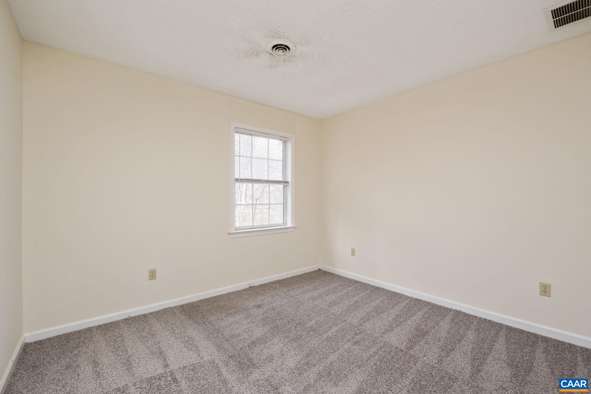 320 Westfield Road Charlottesville, VA 22901 - Photo 24 of 29 an empty room with a window