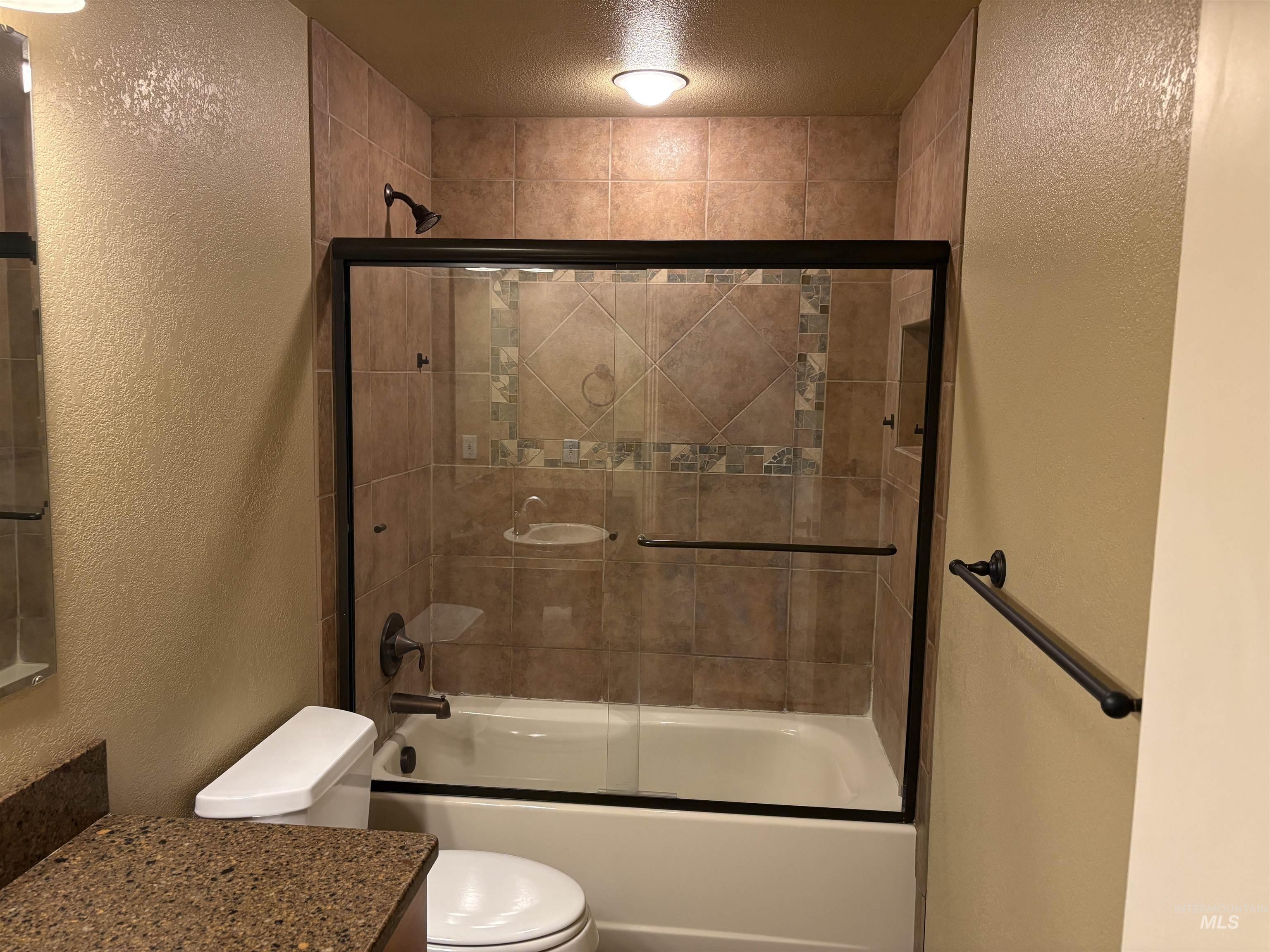 513 Ridge Way Ontario, OR 97914 - Photo 21 of 29 Carpeted room featuring a neutral color palette, a closet with a wooden rod, and a white door with a black handle