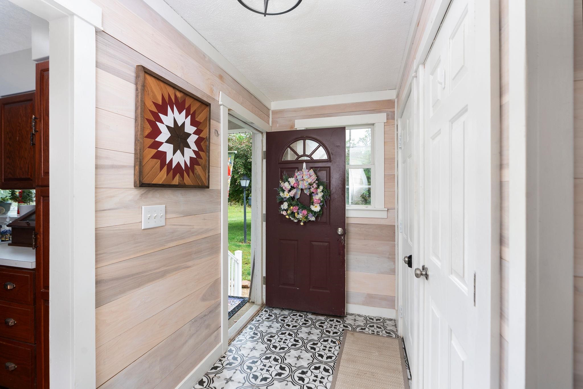 516 Estaline Valley Road Craigsville, VA 24430 - Photo 48 of 75 a view of a hallway with wooden floor and closet