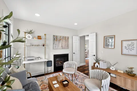 a living room with furniture fireplace and a flat screen tv