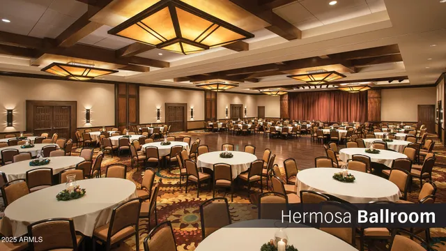 a living room with lots of furniture and a large window