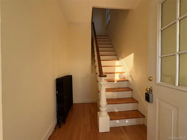 a view of entryway with wooden floor