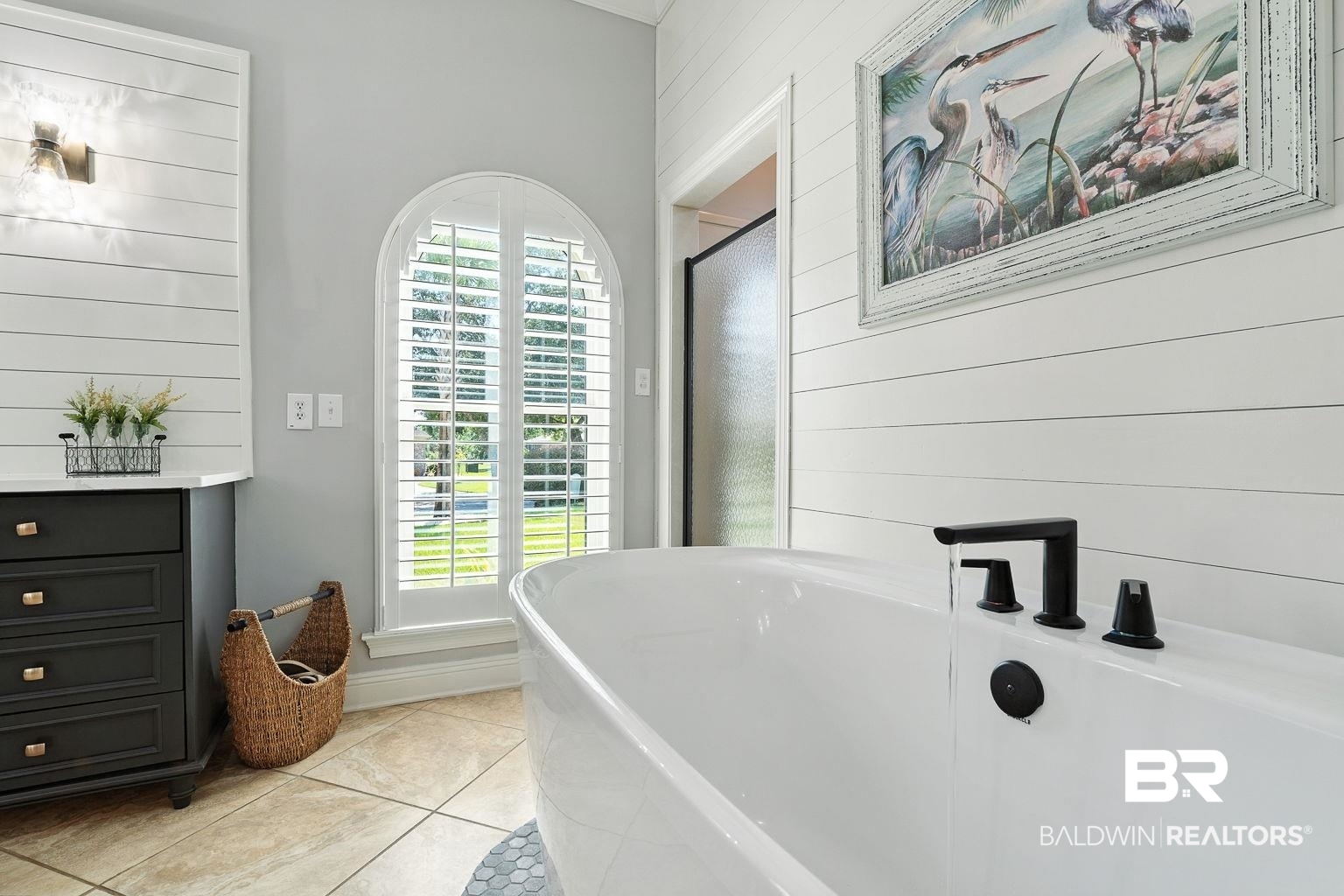 23357 Carnoustie Drive Foley, AL 36535 - Photo 58 of 99 Bathroom featuring tile patterned floors, a soaking tub, wood walls, and an enclosed shower