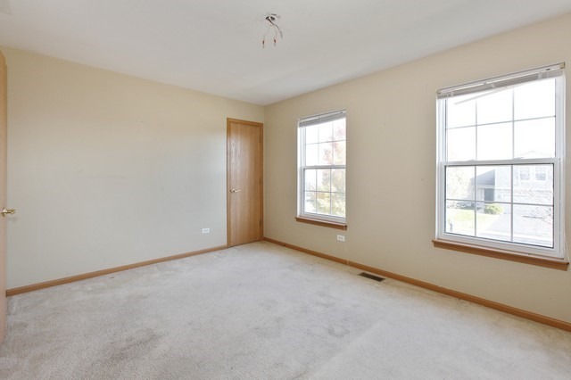 2213 Carpenter Avenue Plainfield, IL 60586 - Photo 11 of 25 an empty room with windows