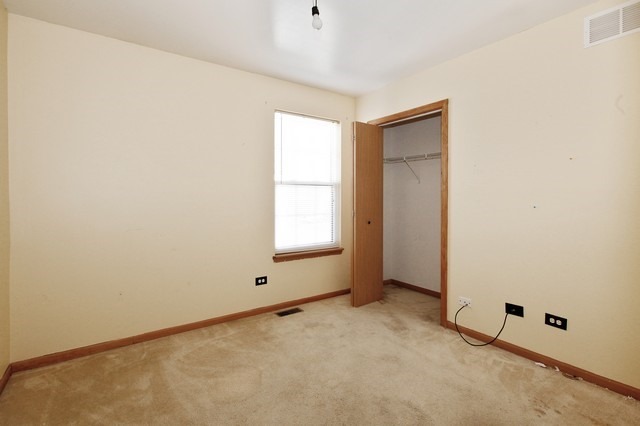 2213 Carpenter Avenue Plainfield, IL 60586 - Photo 13 of 25 a view of an empty room with a window