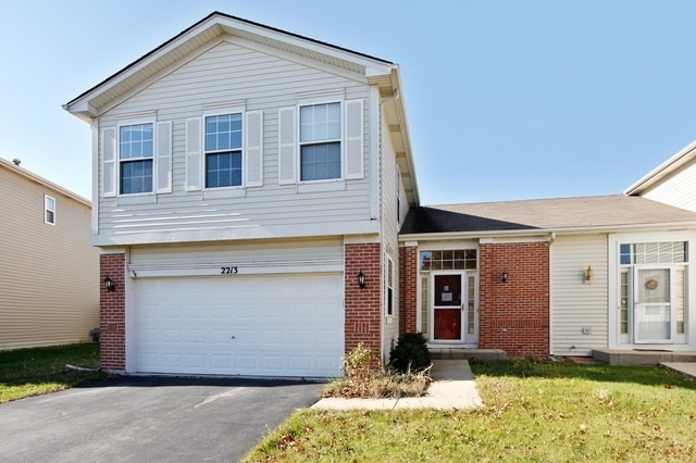 2213 Carpenter Avenue Plainfield, IL 60586 - Photo 2 of 25 a front view of house with yard