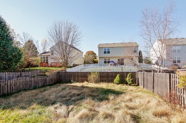 2213 Carpenter Avenue Plainfield, IL 60586 - Photo 21 of 25 a view of swimming pool with a backyard