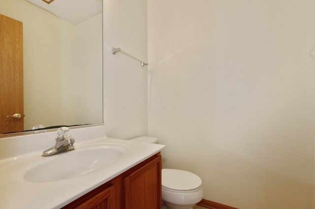 2213 Carpenter Avenue Plainfield, IL 60586 - Photo 24 of 25 a bathroom with a sink toilet and vanity