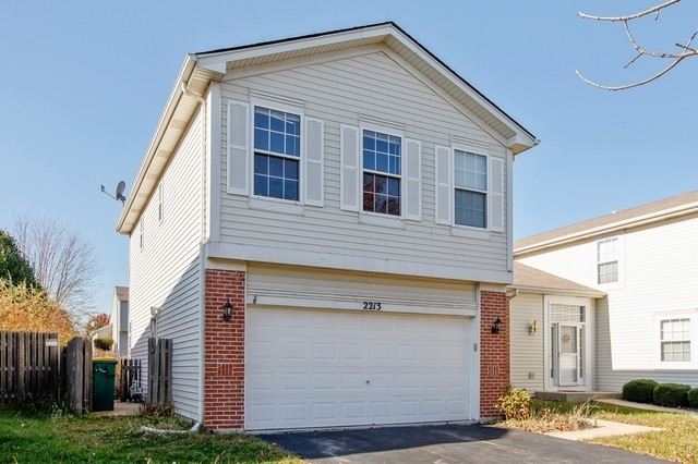 2213 Carpenter Avenue Plainfield, IL 60586 - Photo 25 of 25 a view of a house with a yard