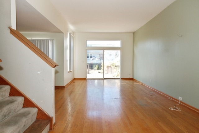 2213 Carpenter Avenue Plainfield, IL 60586 - Photo 3 of 25 a view of an entryway with wooden floor and door